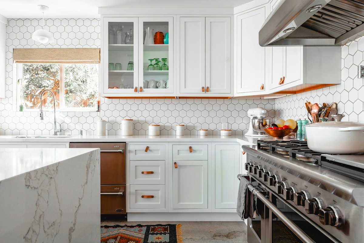 Bright farmhouse style kitchen with white cabinets