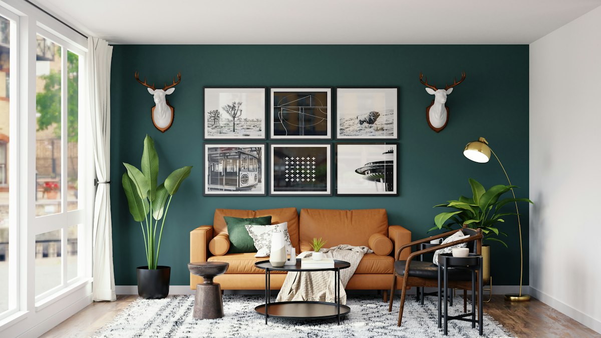 Living room with green accent wall and leather sofa