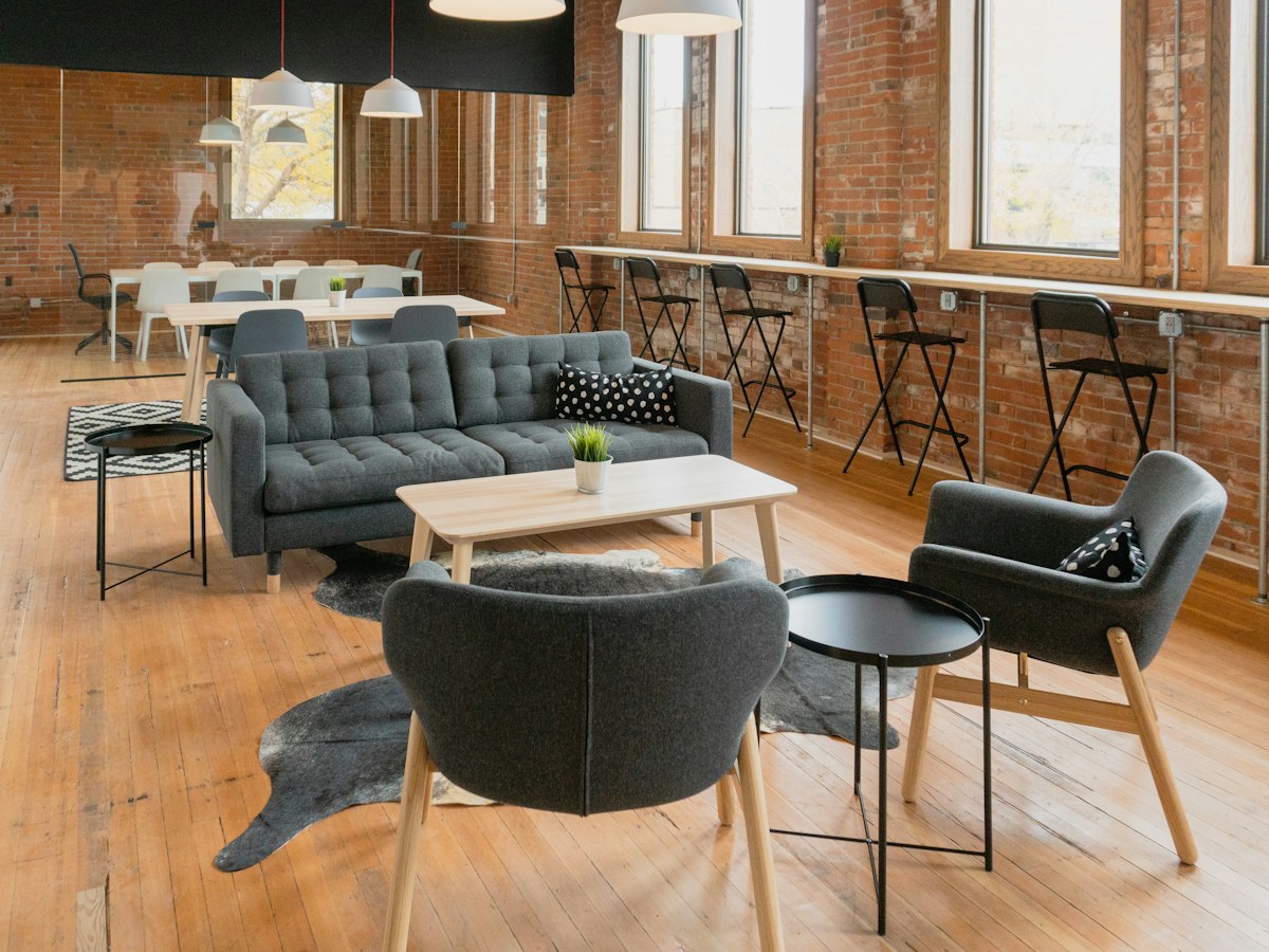 Office lounge with custom seating and brick wall